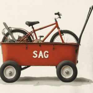 Support and gear wagon (SAG wagon). red wagon labeled as SAG with a bicycle in the back. the mad bandit